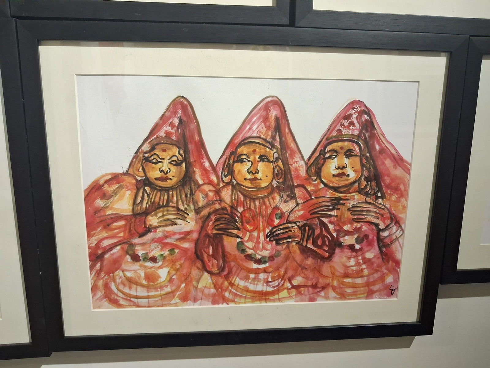 Framed watercolor of three Kathakali figures