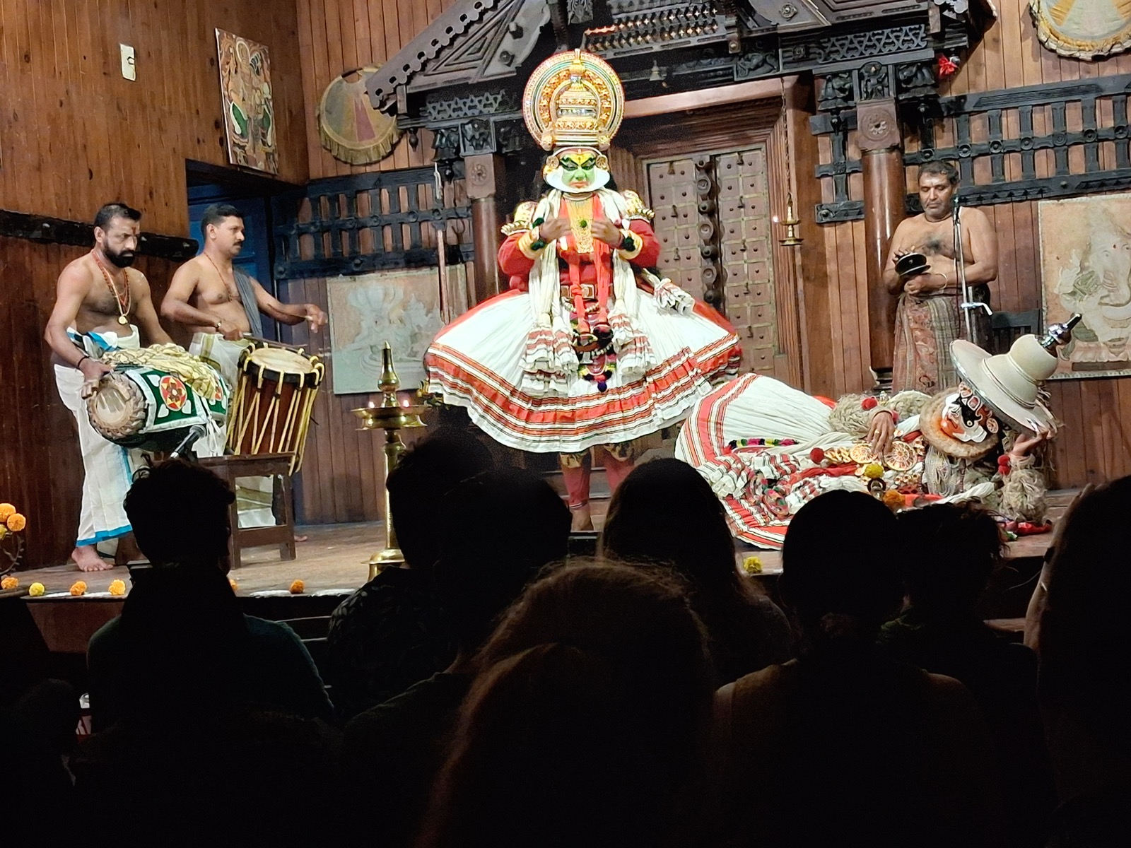 Kathakali performers and musicians on stage in Kochi