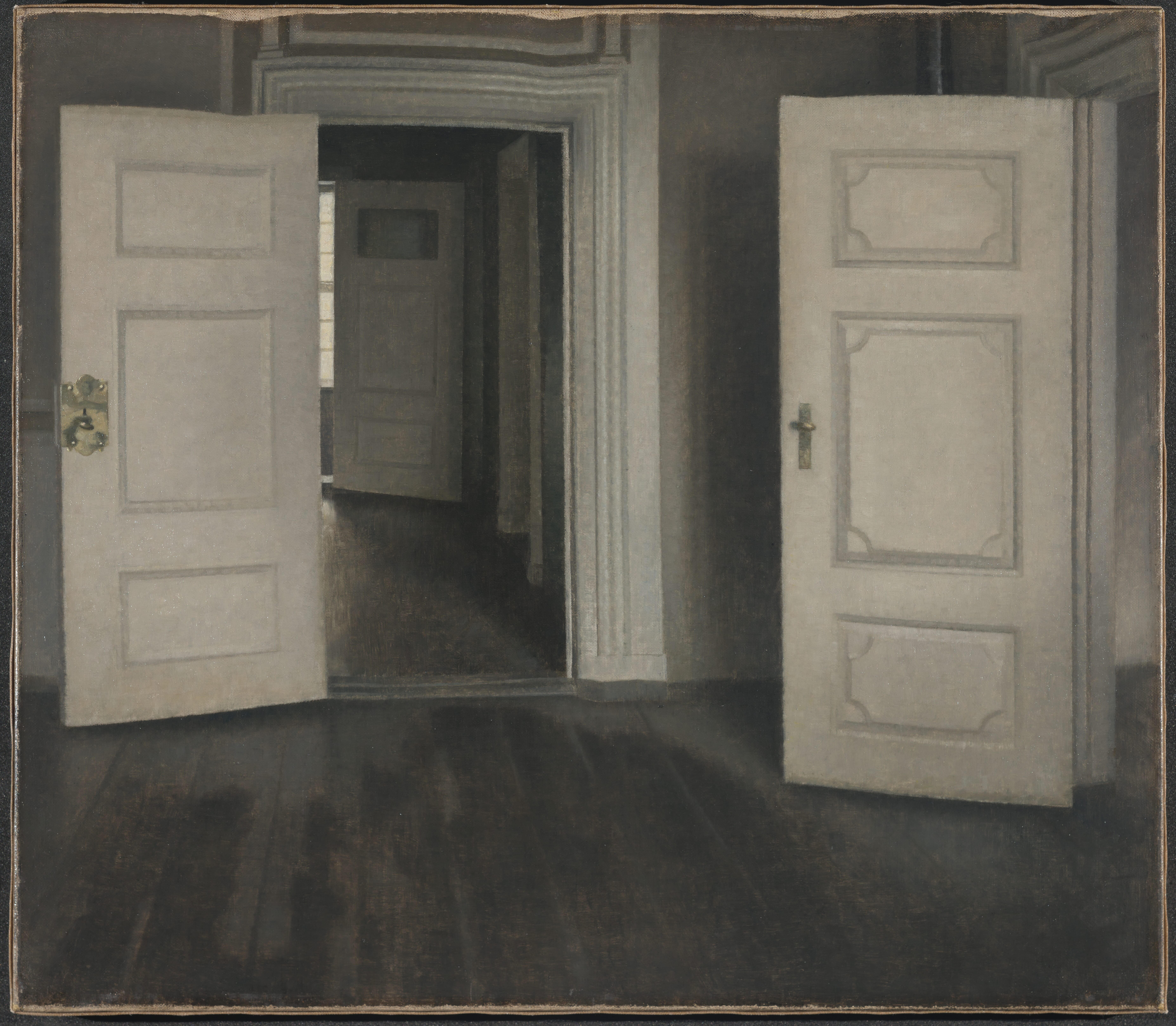 A sequence of empty rooms seen through open white doors