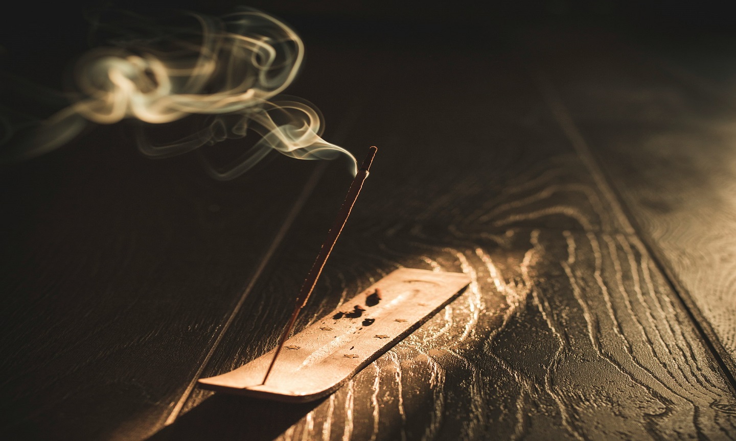 White smoke drifting across a black background