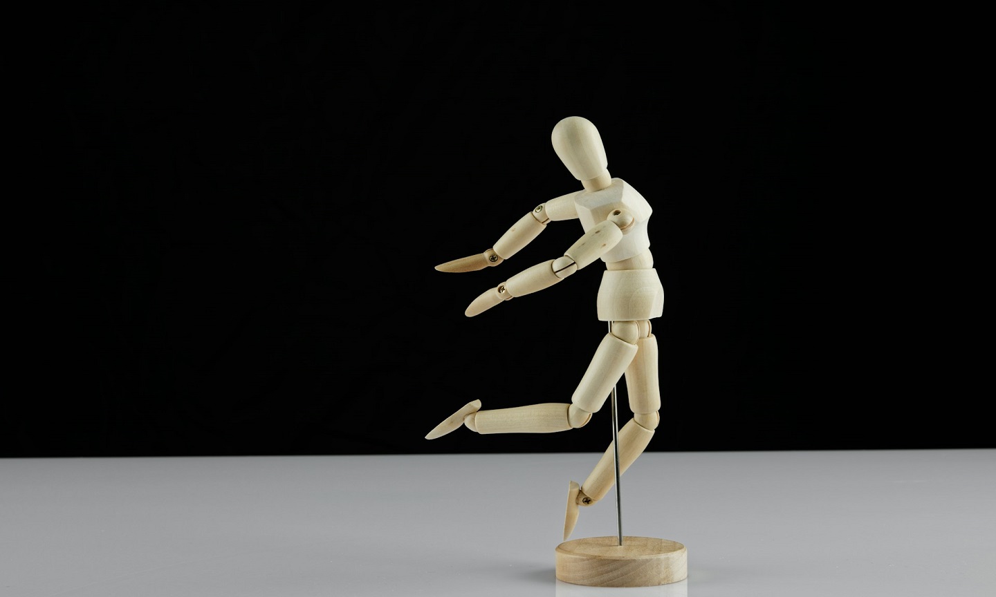 A white anatomical figure on a white surface