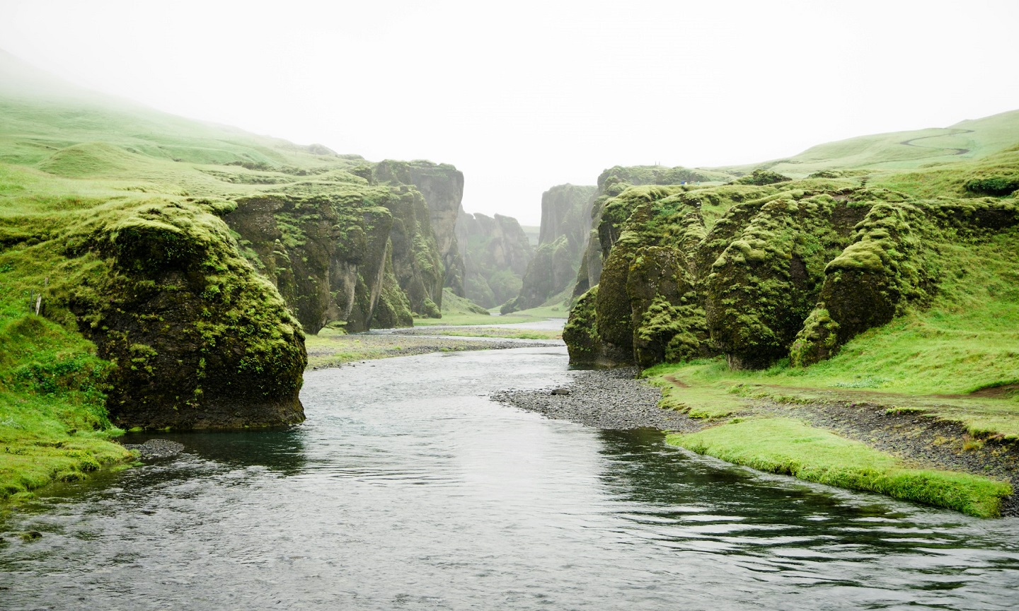 A river winding between green mountains