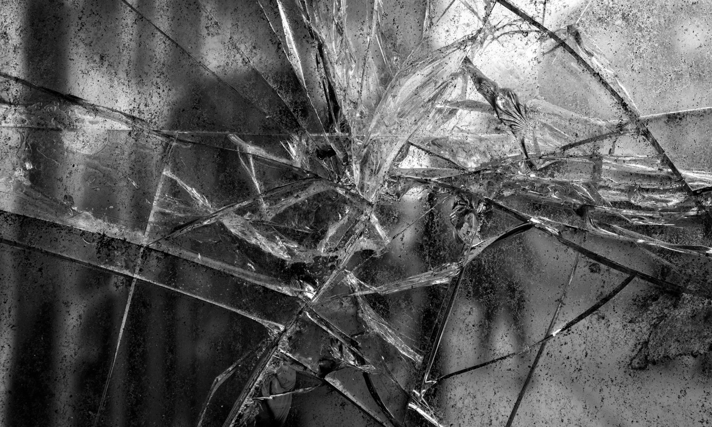 Shattered mirror fragments in black and white